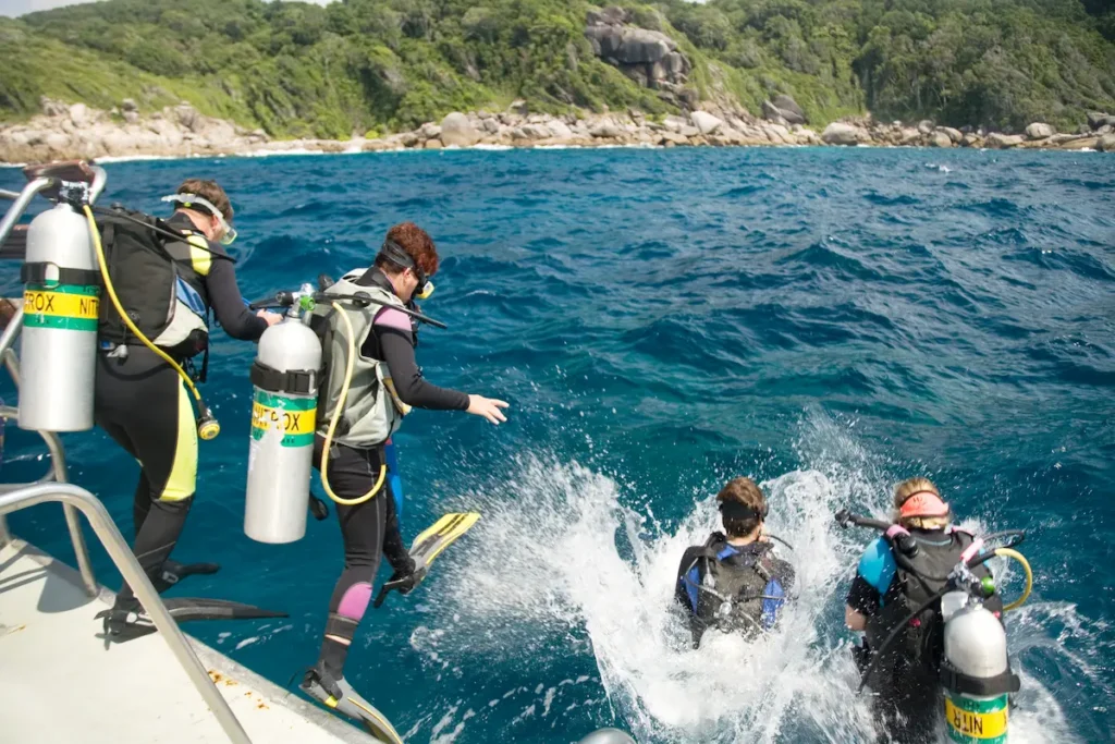 scuba-divers-exploring-tropical-waters-off-boat
